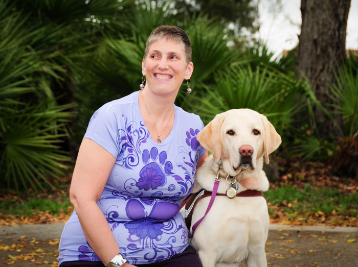A 2013 portrait of Andrea and her yellow Lab guide dog Anders